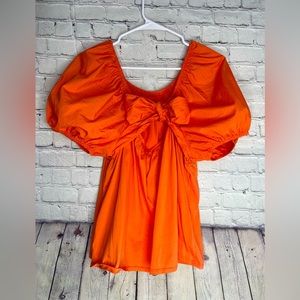 Women’s blouse Soda orange ruffle puff sleeves
Bowtie back or front Target brand